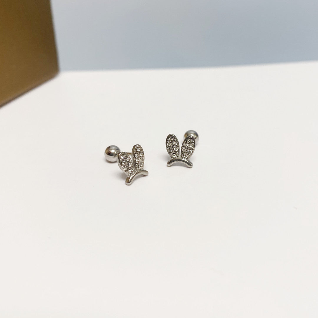 Women's Simple Small Golden Ear Bone Titanium Rings