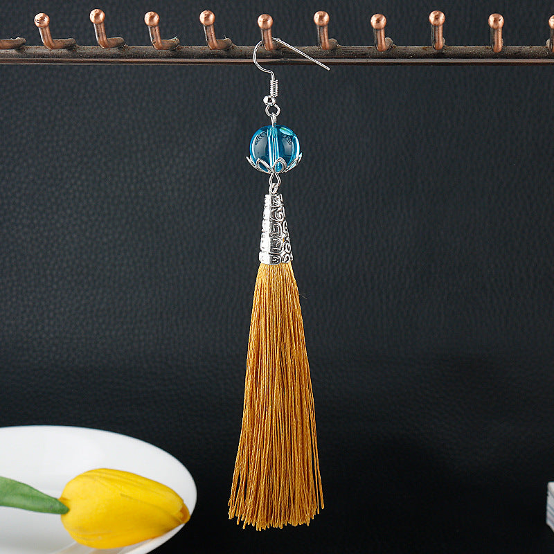 Travelers Empty Autumn Unilateral Temperament Feather Tassel Carved Earrings