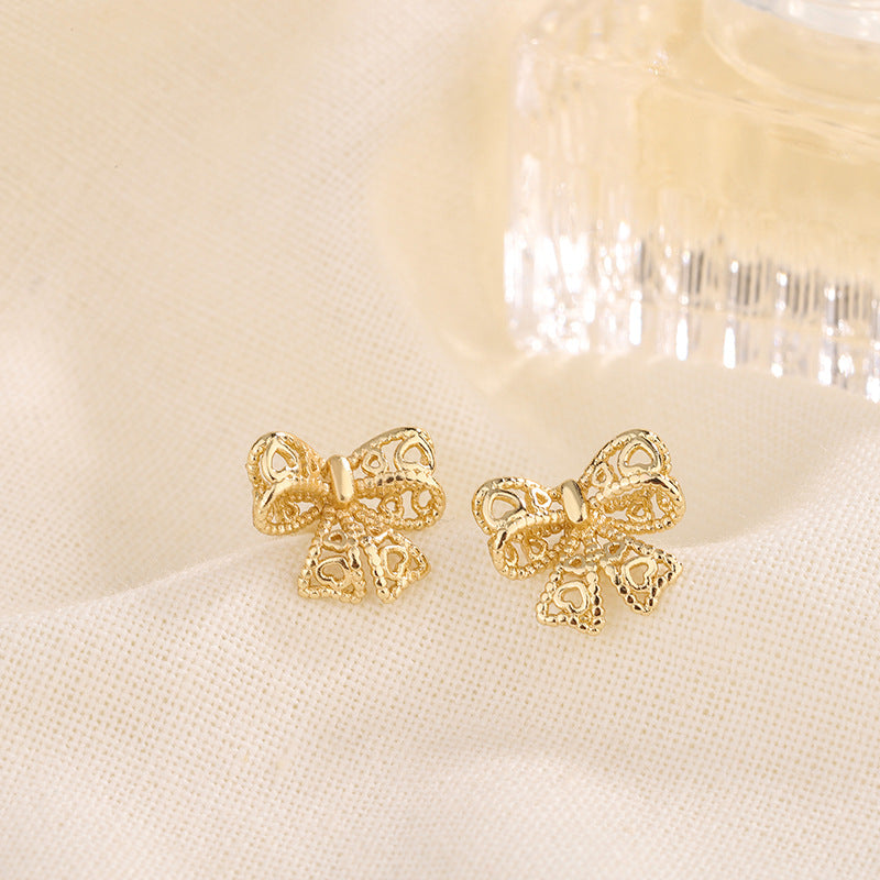 Women's Hollow Out Bow Simple Temperament Niche Earrings