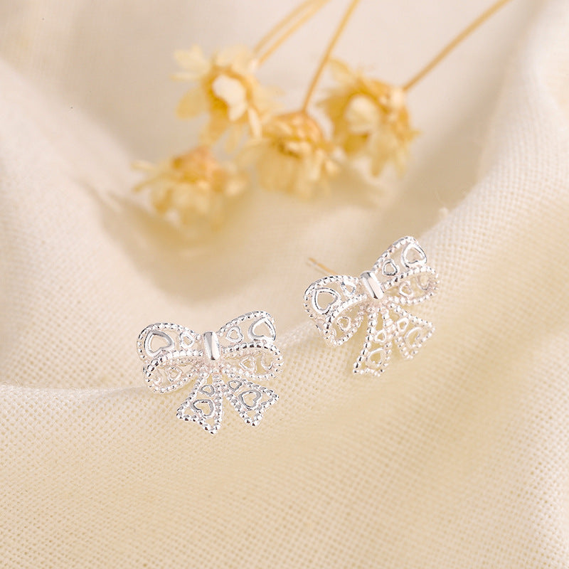 Women's Hollow Out Bow Simple Temperament Niche Earrings