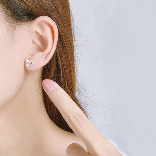 Women's Hollow Out Bow Simple Temperament Niche Earrings