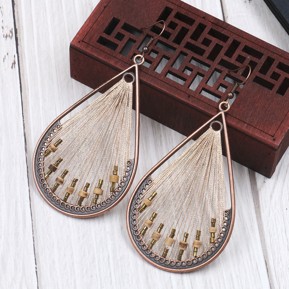 Women's Vintage Tassel Fashion U-shaped Hand-woven Exaggerated Earrings